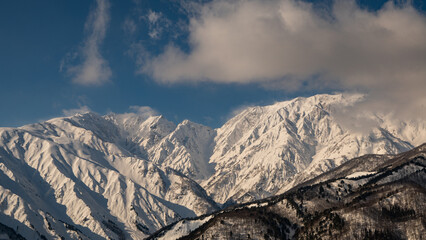快晴の空と冠雪の北アルプス　長野県白馬村