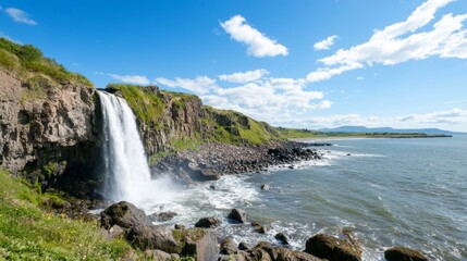 Coastal Waterfall Cascading into Ocean under Sunny Sky