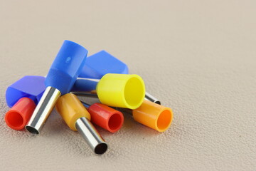 Copper pin colored insulated tips. Close-up. Soft focus.