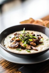 Hearty bowl of oatmeal topped with saut&eacute;ed mushrooms and green onions