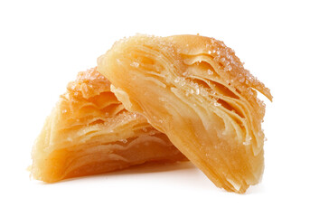 Delicate layers of traditional pastry with a sprinkle of sugar on a white background