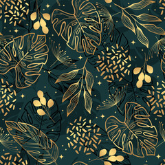 Golden tropical leaves on a green  background. Seamless pattern. Botanical background.