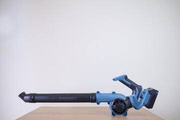 Modern Electric Cordless Leaf Blower. Gardening Technology Portable Air Blower.