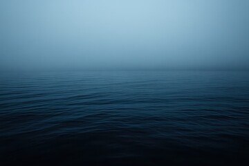Fototapeta premium Misty morning calm envelops the tranquil waters at dawn, invoking serenity and reflection in a quiet coastal landscape. Generative AI