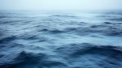 Fototapeta premium Rolling Ocean Waves Under a Misty Sky