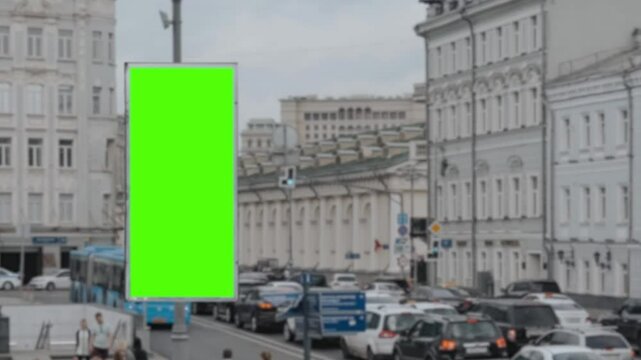 Green screen advertising billboard on the highway exit of the subway station with a city background crowded with workers passing by, suitable for promoting beverage, food, health, transportation, fash