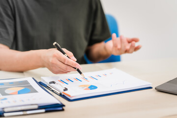 A businessman sitting at a desk in an office, using a laptop, representing accounting, finance,business planning, managing financial data,strategizing business growth,overseeing financial operations