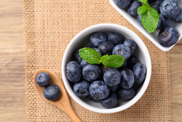 Blueberries in bowl with spoon, Healthy fruit, Food ingredient, Table top view