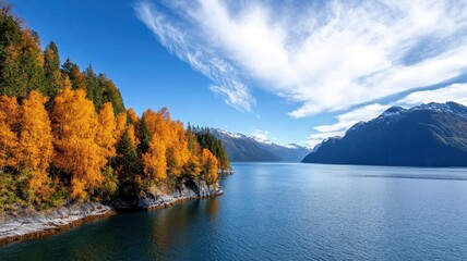 In crisp golden-hued autumn of Alaska, a majestic landscape unfolds, showcasing nature's breathtaking beauty.