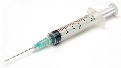 A sterile syringe with a clear barrel and a green-tipped needle, commonly used for medical injections and vaccinations.
