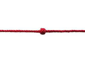 A red rope neatly tied with a secure knot.