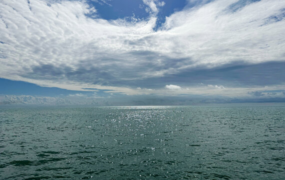 Heaven amazing clouds and sea glittering water.