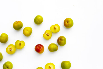 Fresh green plum fruit on white background.