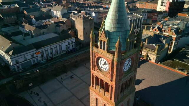 Aerial shot of the Guildhall in Derry-Londonderry, NI. The camera moves upwards, revealing the clock tower. Filmed in 4K at 60fps and in Rec709 color space.
