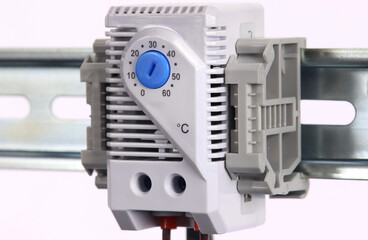 A thermostat to control the fan is installed in the electrical switchboard. 