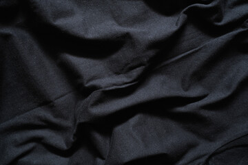 Fototapeta premium Deep Black Fabric with Dramatic Drapes and Shadows