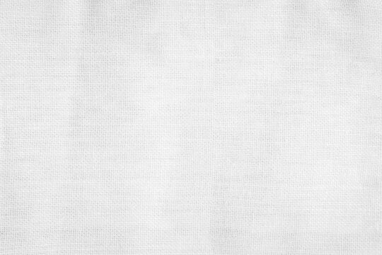 White color fabric canvas woven texture background in pattern light blank. Natural gauze linen, carpet wool and cotton cloth textile textured as clean empty for decoration text. Grey sack material.