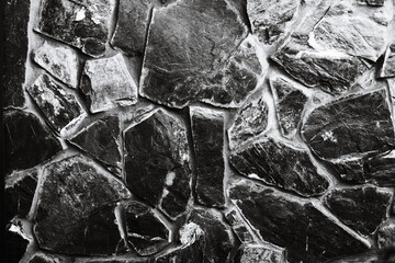 Old stone wall in black and white, great for nostalgic or vintage-themed designs.