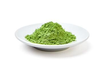 Side view of Green tea powder on white plaete isolated on white background.