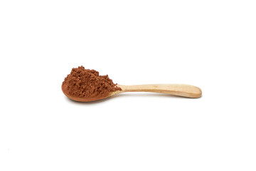 Side view of Cocoa powder on wooden spoon isolated on white background.