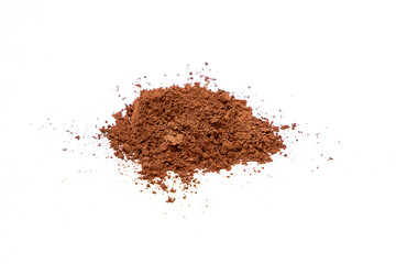 Heap of Cocoa powder scattered isolated on white background.