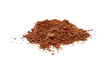 Heap of Cocoa powder scattered isolated on white background.