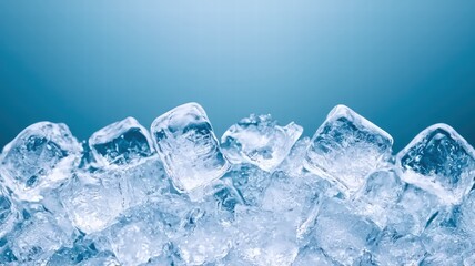 Obraz premium A close-up of clear ice cubes arranged on a surface, with a soft blue background, evoking a refreshing and cool atmosphere.