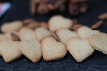 Delicious cookies arranged beautifully on a light background, perfect for Valentine's Day celebrations, romantic gifts, or festive treats. Valentines day background with cookies in shape of heart. 