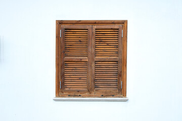 Colorful old wooden house shutters. Wooden shutters of old stone houses. Historical wrought iron examples from the past. Cyprus.