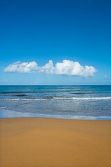 Cyprus Alagadi Turtle Beach. View from the beach to the sea. Magnificent beach, sea and blue cloudy sky. Yellow sand beach. Beach and blue sky.