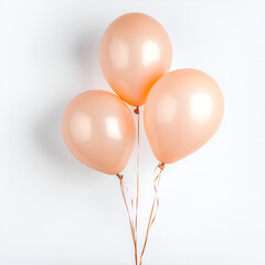 Three Peach-Colored Balloons on White Background
