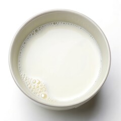 Top View of a Bowl of Milk on a White Background