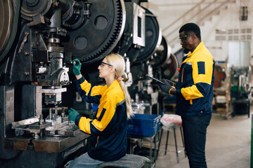 caucasian women worker working in heavy metal industry factory punching stamping steel machine