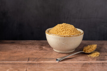 Light brown granulated sugar in a bowl, copy space