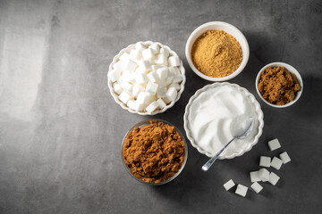  Different type of sugar. Light brown, dark brown and white sugar cubes in bowls.