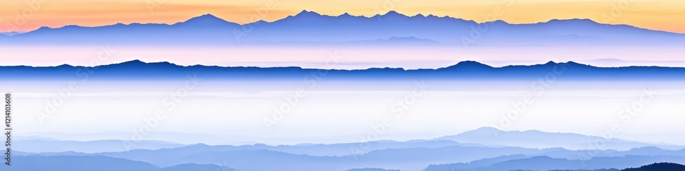 Aufkleber layered mountain range view with soft gradient of colors and hazy atmosphere at sunrise