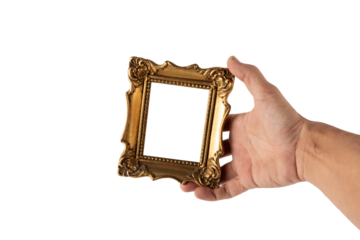 Male hand holding a vintage golden mini picture frame isolated no background cutout