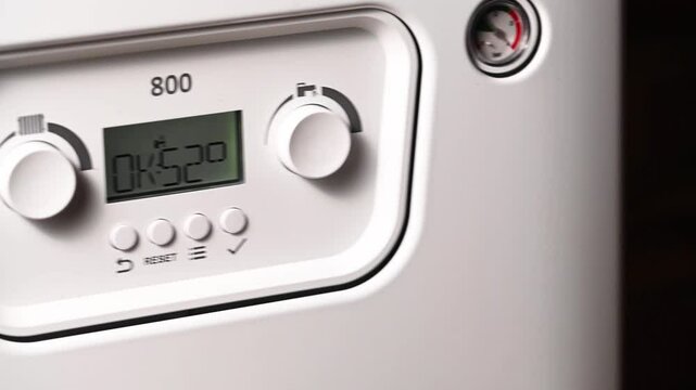 Increasing price for gas. Control panel of central heating at combi boiler. 