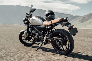 Motorbike in sand sea or desert. Adventure and travel for extreme sports challenge. Off road