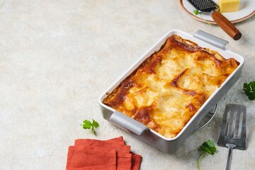 Step by step cooking of lasagna with mushrooms and chicken on a light concrete background. Step by step recipes.