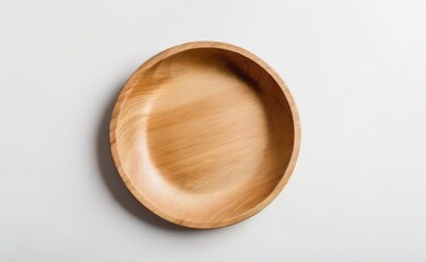 A smooth, organic-shaped wooden bowl rests on a clean white background.