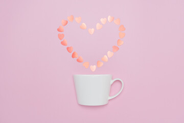 Creative minimalist composition of a white coffee cup releasing a heart-shaped arrangement of soft pastel hearts, set against a pink background, symbolizing love and warmth.