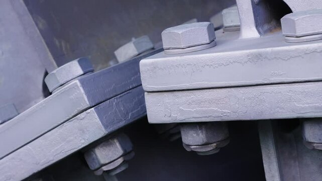 Detailed view of high tensile nuts, bolts securing steel girder flanges on Sky Bridge 721 walkway, Czechia