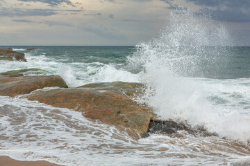 The beautiful beach on the coast of the Indian Ocean in Sri Lanka.