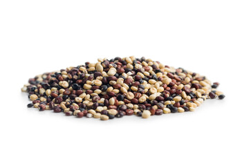 Mixed uncooked quinoa seeds isolated on white background.
