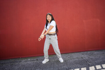 Urban dancer performing K-pop choreography in the city