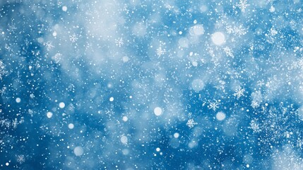 Abstract winter background with snowflakes and bokeh.
