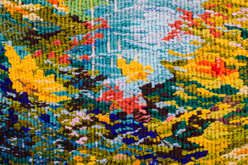 Colorful abstract embroidered fabric pattern background