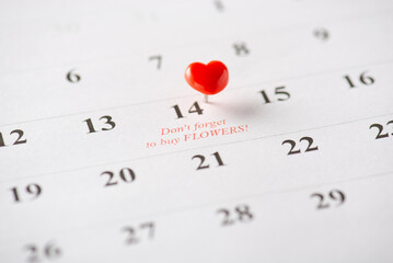 A calendar displays February 14th, marked with a heart-shaped pin and a romantic note
