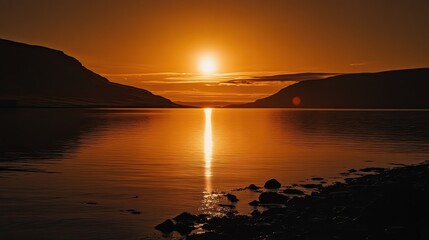 Sunset over calm fjord, mountains silhouette, golden hour, travel photography.
